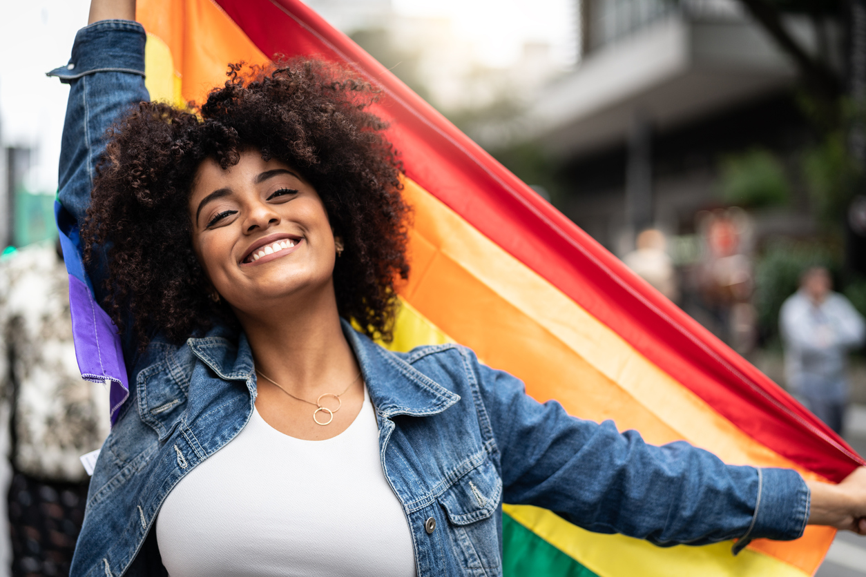 Woman Waving Rainbow Flag at Gay Parade